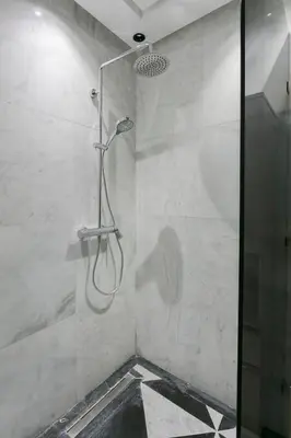 a shower with a glass door in a bathroom at Maison Elysium Hivernage Marrakech in Marrakech