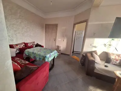 a living room with a couch and a table at Charming Apartment at Marrakech in Marrakech