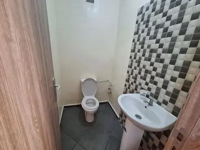 a bathroom with a toilet and a sink at Charming Apartment at Marrakech in Marrakech