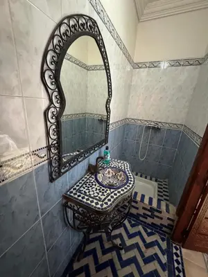 a bathroom with a sink and a mirror at ASA House in Marrakech