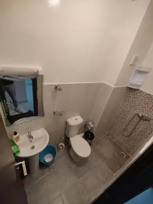 a small bathroom with a toilet and a sink at Dyour marjan in Marrakech