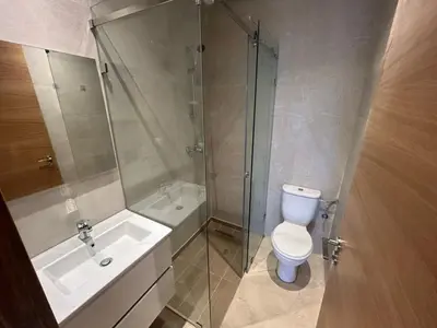 a bathroom with a shower and a toilet and a sink at Prestigia golf in Marrakech