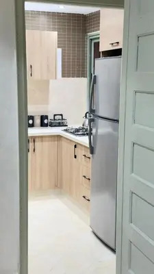 a kitchen with a refrigerator and a stove at Just renovated appartement in marrakech in Marrakech
