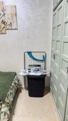 a room with a bird cage next to a door at Just renovated appartement in marrakech in Marrakech