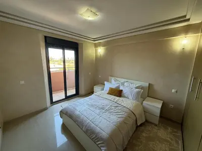 a bedroom with a large bed and a large window at Prestigious Villa in Marrakesh in Marrakech