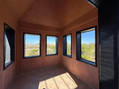 a room with four windows in a house at Prestigious Villa in Marrakesh in Marrakech