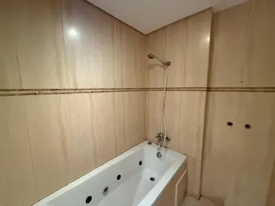 a bathroom with a bath tub and a shower at Prestigious Villa in Marrakesh in Marrakech