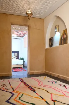 a living room with a rug on the floor at dar dmana in Marrakech