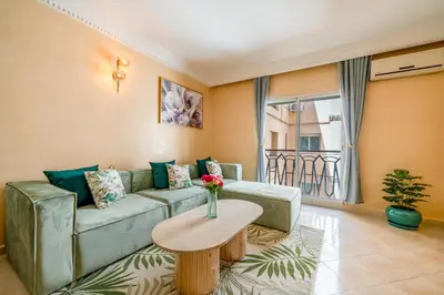 a living room with a couch and a table at Cocon De Luxe Proche du Centre in Marrakech