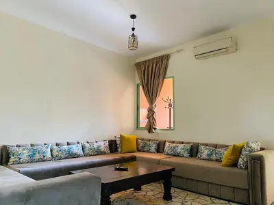 a living room with a couch and a table at Comfortable Apartment Stay in Marrakech