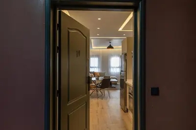 a door leading to a kitchen and a dining room at Cosy and fully equipped 2bed appt in Gueliz in Marrakech