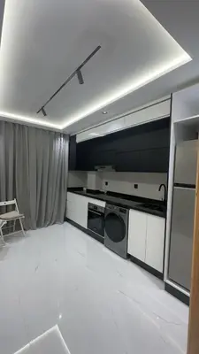 a kitchen with a stove and a dishwasher at Appartement a marrakech gueliz au centre ville in Marrakech