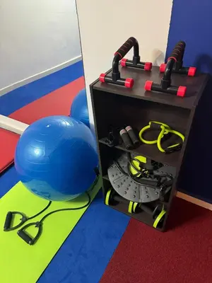 a room with a table with a ball and equipment at Magnifique Villa piscine chauffée, cinéma et salle de fitness privés in Marrakech