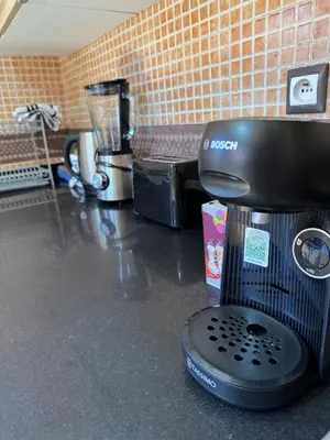 a coffee maker sitting on a counter in a kitchen at Villa Oasis Marrakesh in Marrakech