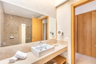 a bathroom with a sink and a mirror at Villa Aila Elegant 6 Bedrooms Spa, Cinema Pool in Marrakech