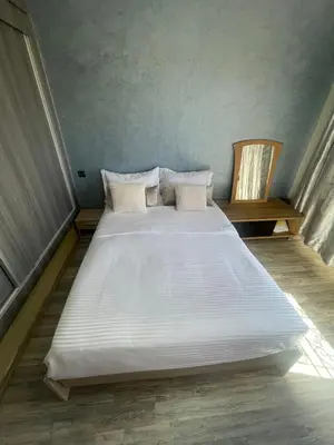 a large white bed sitting in a room at Villa Marrakech avec Piscine in Marrakech