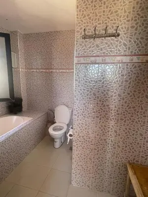 a bathroom with a toilet and a sink and a shower at Villa Marrakech avec Piscine in Marrakech