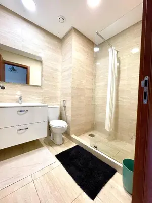 a bathroom with a toilet and a shower and a sink at Prestigia aghat in Marrakech