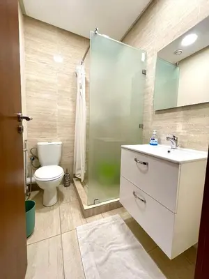 a bathroom with a toilet and a sink and a shower at Prestigia aghat in Marrakech