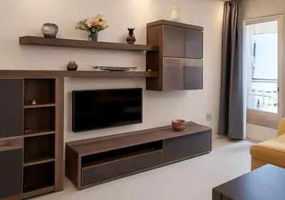 a living room with a large entertainment center with a television at Walili 1 in Marrakech