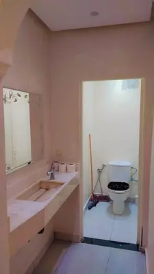 a bathroom with a sink and a toilet at شقة مفروشة in Marrakech