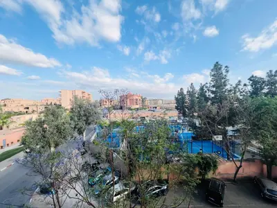 a view of a water park with trees and buildings at Apprt luxueux l'Hivernage au centre ville proche de la gare ,M avenu CR07 in Marrakech