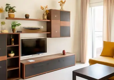 a living room with a flat screen tv on a entertainment center at Appart Walili in Marrakech