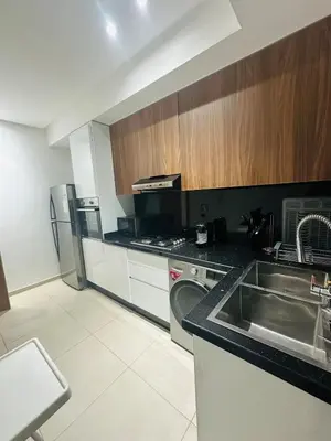 a kitchen with a sink and a refrigerator at 3 bedroom apartment in Marrakech