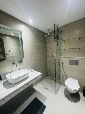 a bathroom with a toilet and a sink and a shower at 3 bedroom apartment in Marrakech