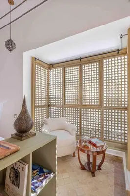 a living room with a couch and a table at Riad Bayda in Marrakech
