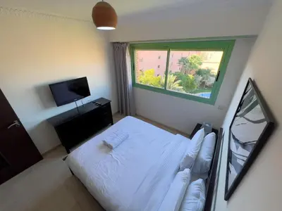 a bedroom with a white bed and a window at Stylish Stay downtown in Marrakech
