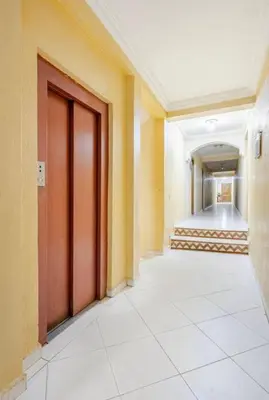 an empty hallway with a door in a building at Eden Vibes GUELIZ in Marrakech