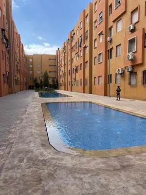 a swimming pool in the middle of a building at Marrakech Luxe & confort Appartement in Marrakech