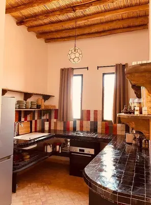 a kitchen with a counter top in a room at Dar Tal, Marrakech in Douar Oulad Ali