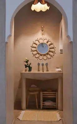 a bathroom with a sink and a mirror at Riad Nūr in Marrakech