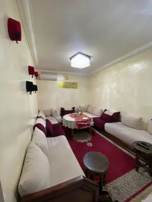a living room with a couch and a table at Marrakech Gateway in Oulad Akkou