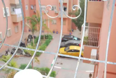 a view from a balcony of a street with cars at Marrakech Gateway in Oulad Akkou