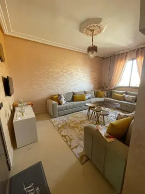 a living room with a couch and a table at Jasmine house in Marrakech in Marrakech