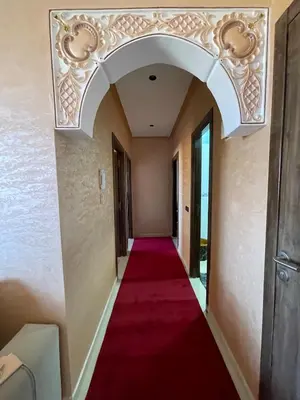a hallway with a red carpet and a ceiling at Jasmine house in Marrakech in Marrakech