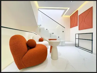 a living room with a heart chair and stairs at Triplex De Luxe Ocra piscine privée in Marrakech