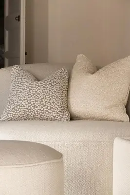 a white couch with two pillows on top of it at Riad Djannaat Exceptional private riad pool staff in Marrakech