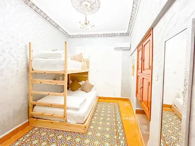 a bedroom with two bunk beds in a room at Bubbly Hostel Marrakech in Marrakech