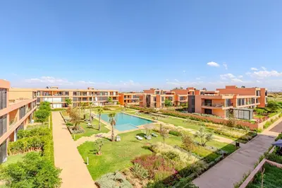an aerial view of an apartment complex with a swimming pool at New! Appt moderne avec terrasse et vue piscine in Marrakech