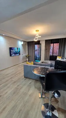 a living room with a couch and a table at Luxury Penthouse and Jacuzzi at Hivernage in Marrakech