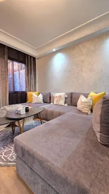 a living room with a couch and a table at Luxury Penthouse and Jacuzzi at Hivernage in Marrakech