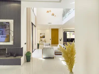 a living room with a couch and a chair at VILLA DE LUXE à Marrakech, GOLF, Piscine, 10 min du centre in Marrakech