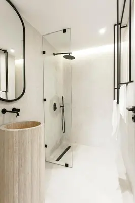 a bathroom with a glass shower and a sink at The view City Center in Marrakech