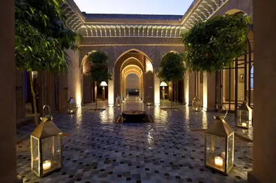 an empty lobby with a large building with trees at Villa de luxe avec piscine sur le golf d'amelkis in Marrakech