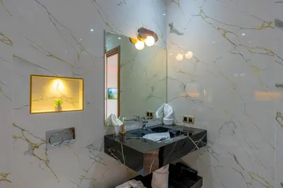 a bathroom with a sink and a mirror at Villa Mareva & Spa Marrakech in Marrakech