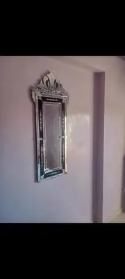 a mirror on a wall in a room at Appart 2 CH lumineux et une piscine pour votre séjour in Marrakech